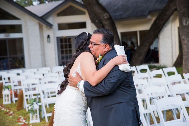 Bethany's fathers first look hugging at her wedding at Los Encinos