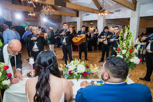 David and Bethany's mariachis playing wedding reception at Los Encinos