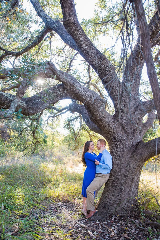 Coltan and Stephanie engagement under the tree at Cibolo Natural Area