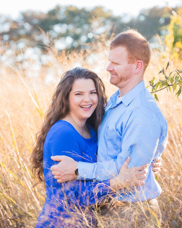 Coltan and Stephanie laughing at the engagement at Cibolo Natural Area