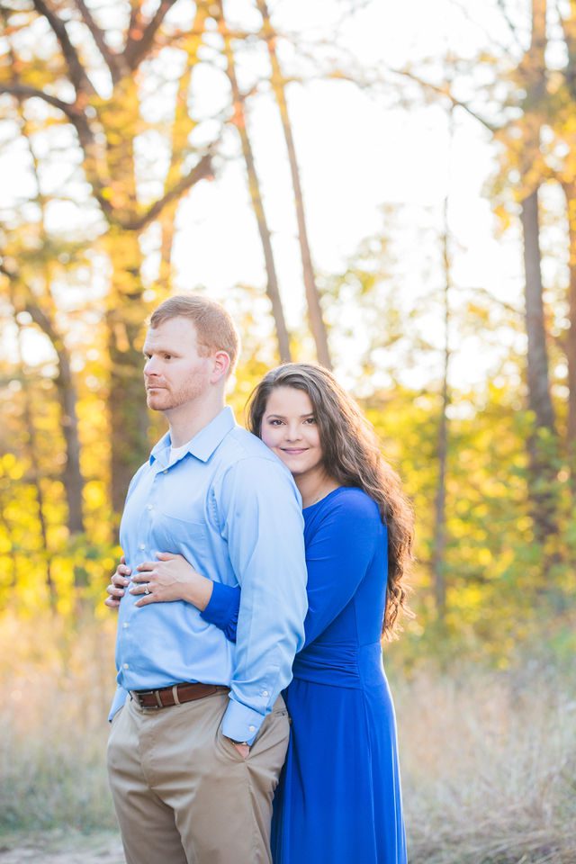 Coltan and Stephanie's the engagement at Cibolo Natural Area in in front of the trees