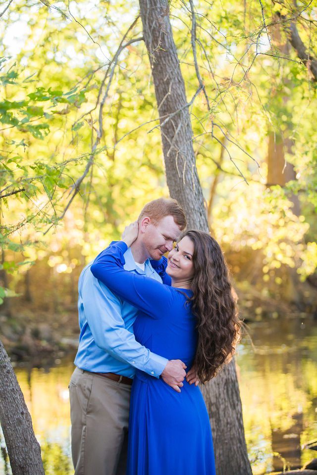 Coltan and Stephanie's the engagement at Cibolo Natural Area hugging in the sun