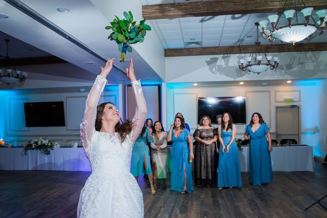 Stephanie's wedding reception at the Kendall Inn bouquet toss