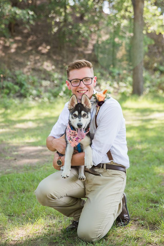 Haley's Wedding at Elm Pass Woods groom with the puppy