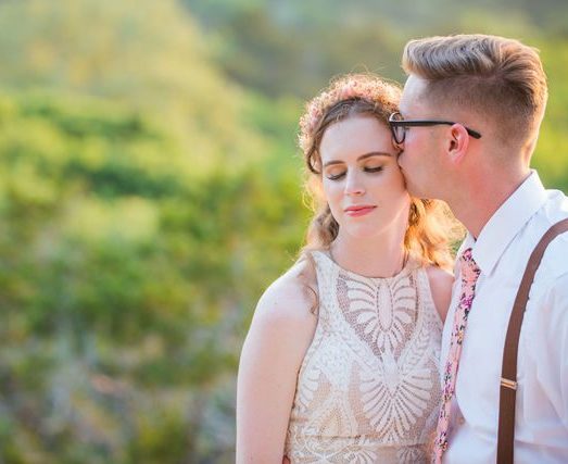 Haley's Wedding at Elm Pass Woods reception golden hour cheek kiss