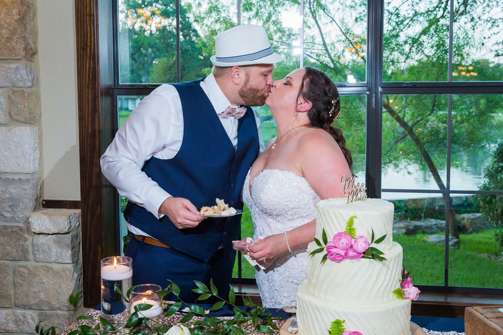 Jenny's wedding reception cake kiss at the Club at Garden Ridge
