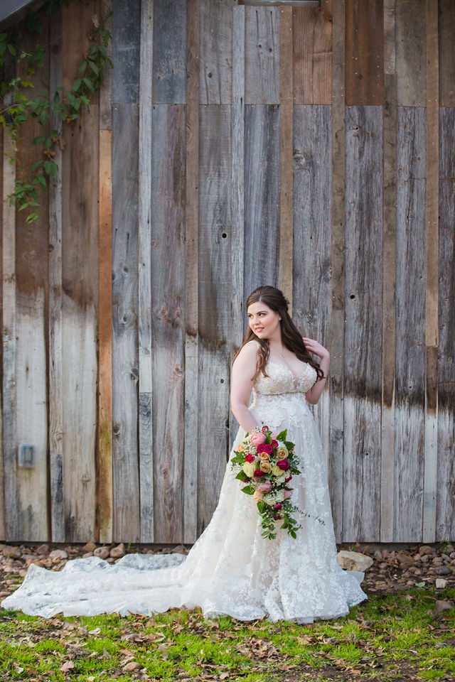 Meagan Bridal at the Gruene Hall on the wood wall looking back