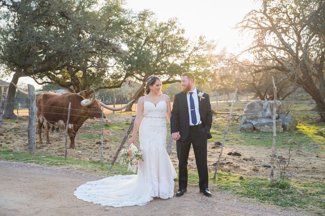 Yoli's couple portrait at the wedding at Canyon Springs with the cows