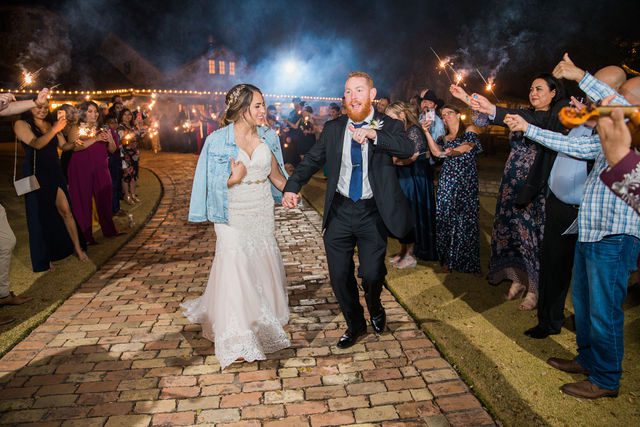 Yoli's and Daltin wedding reception sparkler exiting at Canyon Springs