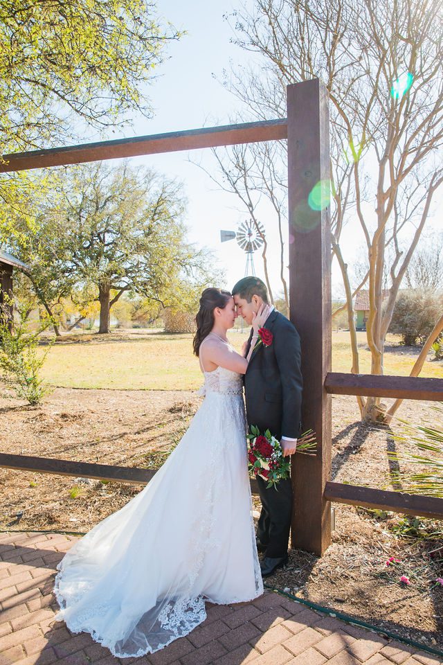 Allison wedding at Hofmann Ranch bride and groom portrait with windmill