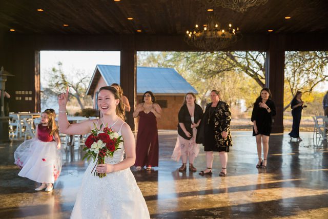 Allison wedding at Hofmann Ranch reception wedding bouquet toss