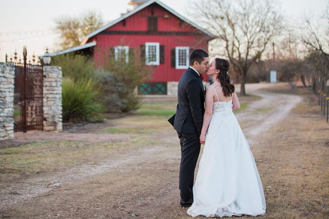 Allison's wedding at Hofmann Ranch sunset portrait on the path kiss
