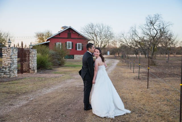 Allison's wedding at Hofmann Ranch sunset portrait on the path head kiss