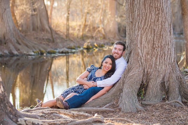 Bethany and Adam engagement Cibolo Natural Area sitting by the river