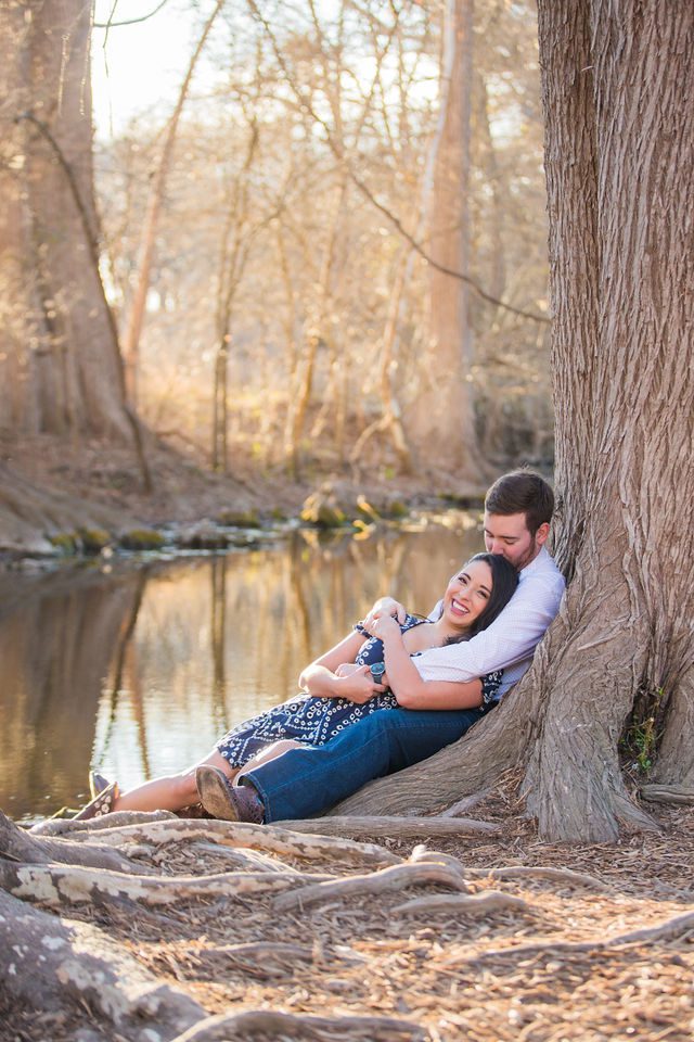 Bethany and Adam engagement Cibolo Natural Area laying by the river
