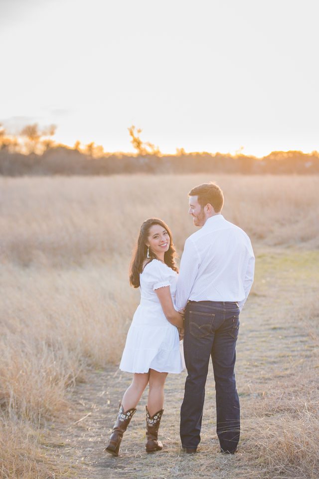 Bethany and Adam engagement walking on the path Cibolo Natural Area