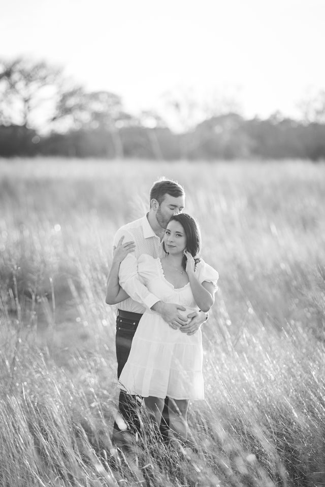 Bethany and Adam engagement head kiss at Cibolo Natural Area black and white