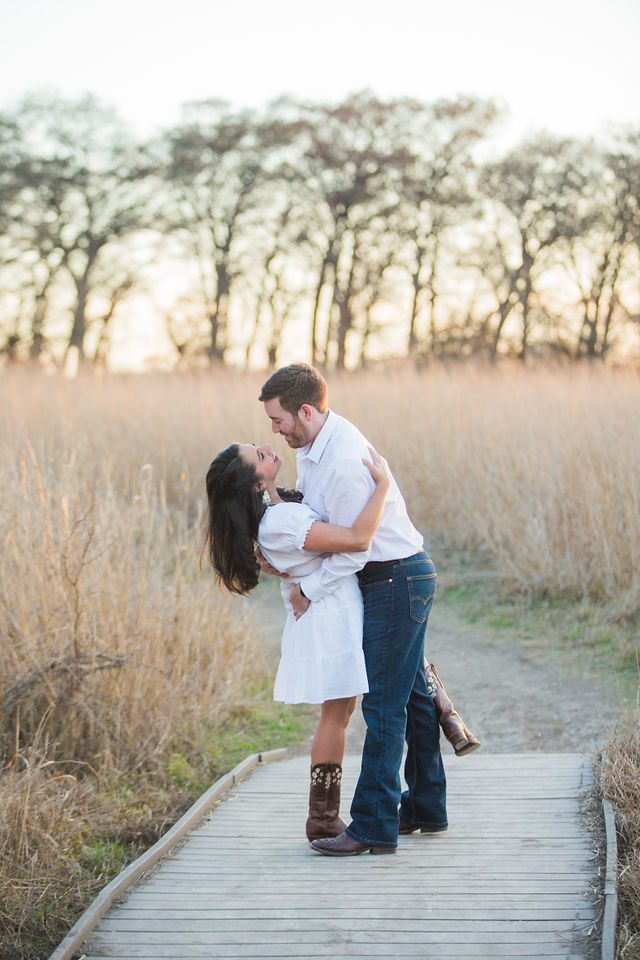 Bethany and Adam engagement dip on the bridge at Cibolo Natural Area