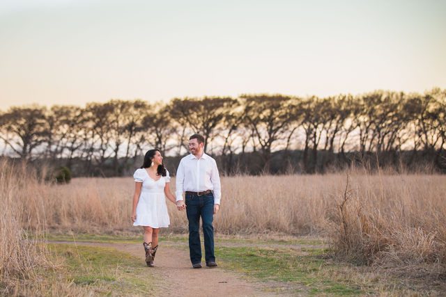 Bethany and Adam engagement at Cibolo Natural Area in the sunset walking