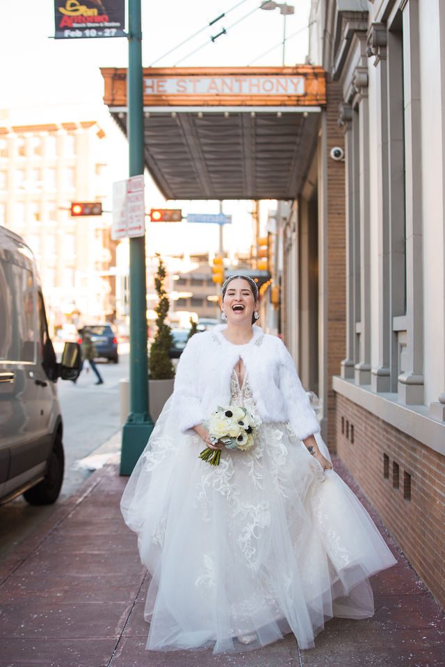 Bonnie's Bridal at the St Anthony Hotel bride on the sidewalk