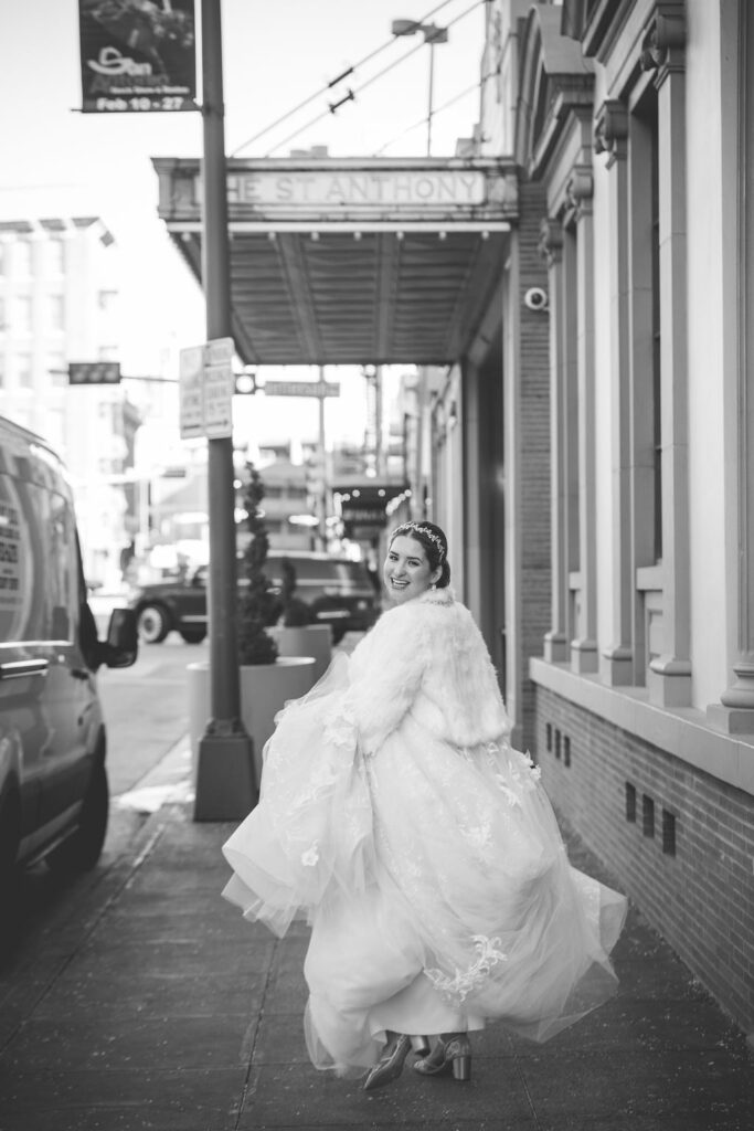 Bonnie's Bridal at the St Anthony Hotel walking down the street in black and white