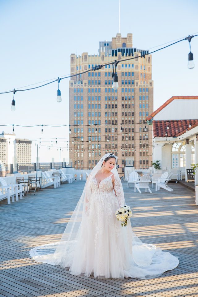 Bonnie's Bridal at the St Anthony Hotel on the rooftop with Frost building veil