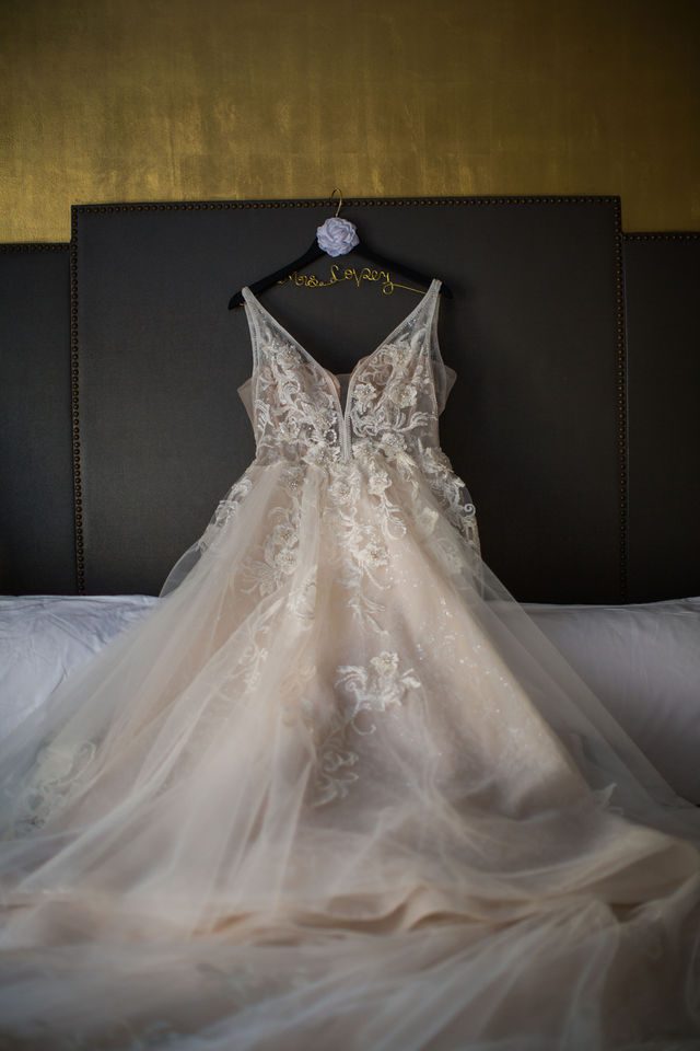 Bonnie's wedding Bridal gown on the bed at the St Anthony Hotel