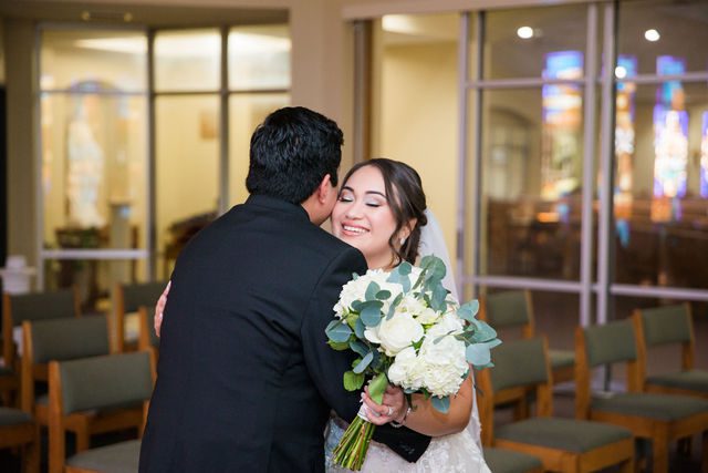 Chloe's San Antonio wedding first look at St. Dominic's Catholic Church hug