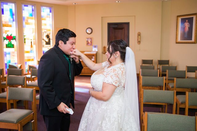 Chloe's San Antonio wedding first look at St. Dominic's Catholic Church hand kiss