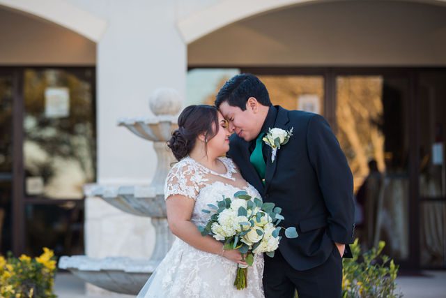 Chloe's San Antonio wedding reception at Las Fuentes couple touching heads