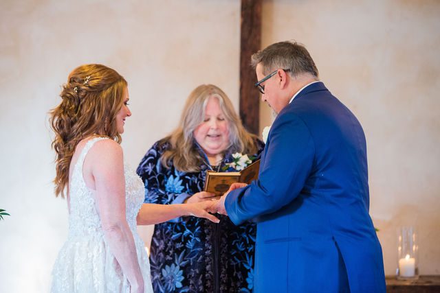 Deborah's Lost Mission wedding bride and groom ceremony ring exchange