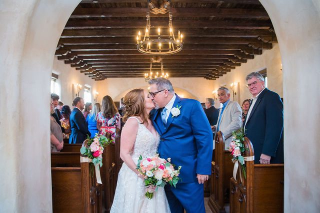 Deborah's Lost Mission wedding bride and groom ceremony exit kiss