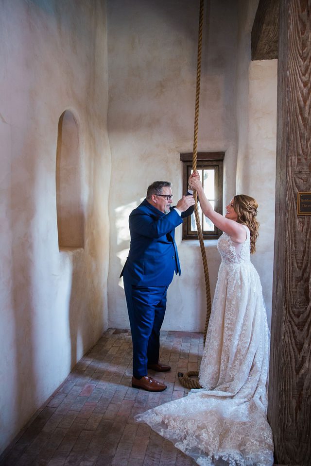 Deborah's Lost Mission wedding bride and groom ring the bell