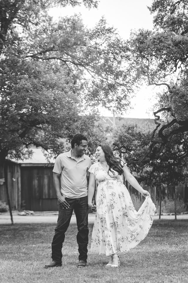 Elexes engagement portrait in Gruene laughing in black and white