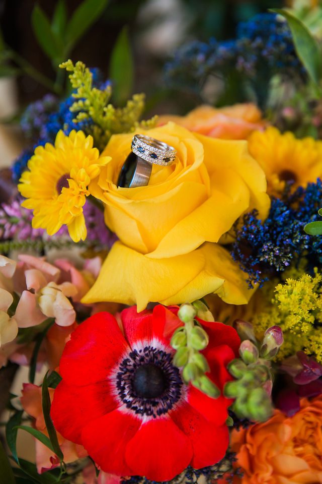 Liz's wedding at Enchanted Springs Ranch rings in flowers