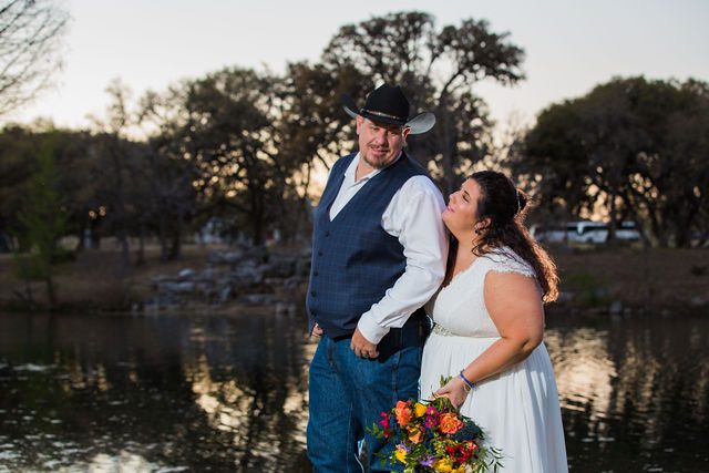 Liz's wedding at Enchanted Springs Ranch sunset portrait back hug