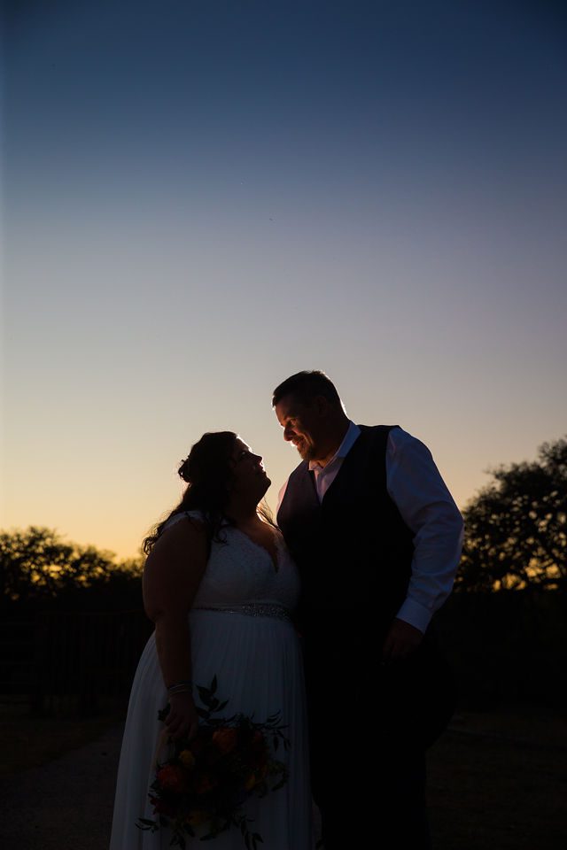 Liz's wedding at Enchanted Springs Ranch sunset backlit portrait