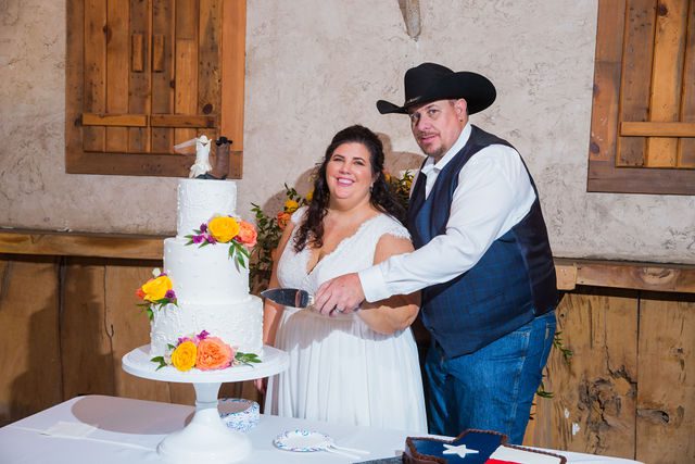 Liz's wedding at Enchanted Springs Ranch cake cutting