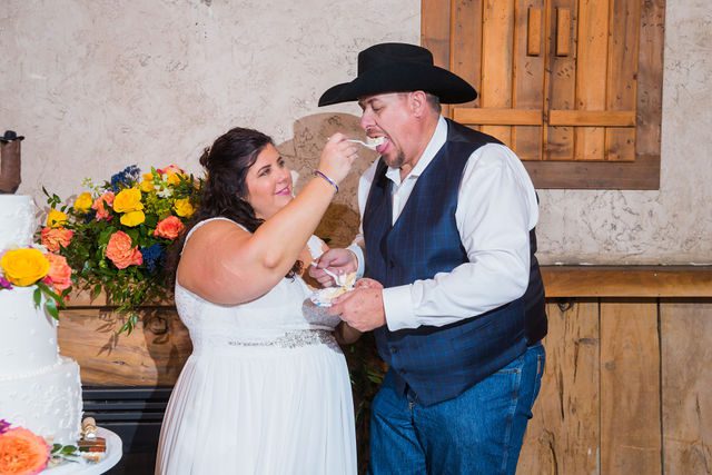 Liz's wedding at Enchanted Springs Ranch cake feeding