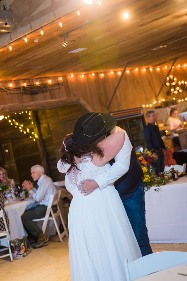 Liz's wedding at Enchanted Springs Ranch first dance hug