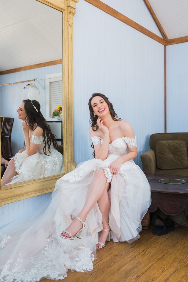 Graysen wedding in Comfort bride laughing in bridal suite