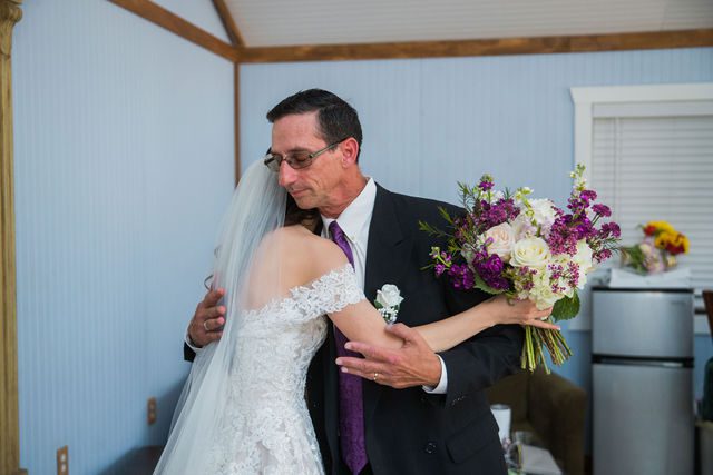 Graysen wedding in Comfort bride and dad hugging in bridal suite