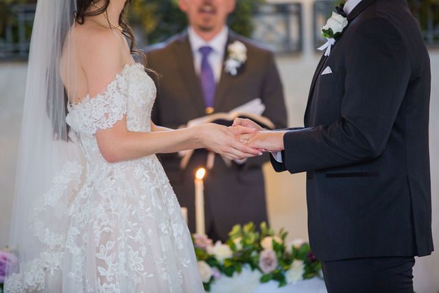 Graysen wedding ceremony in Comfort bride and groom hands