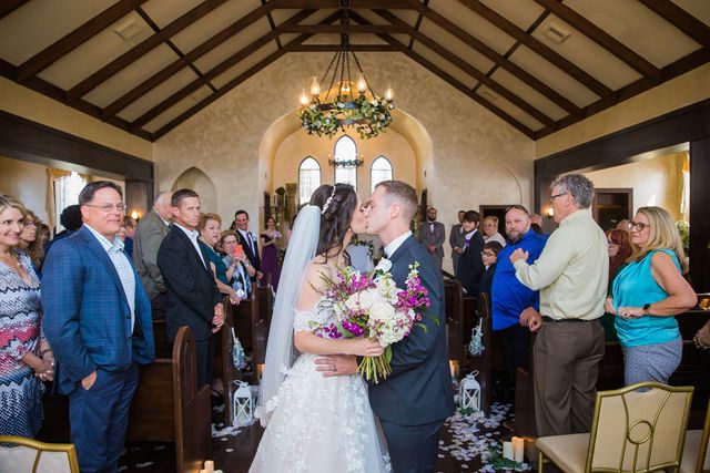 Graysen wedding ceremony exit in Comfort bride and groom kiss