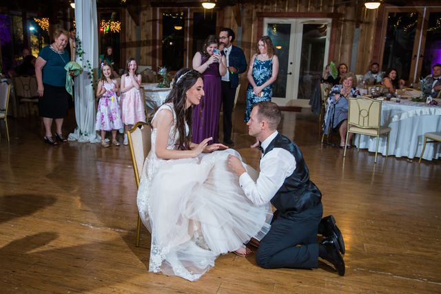 Graysen wedding ceremony in Comfort reception garter toss