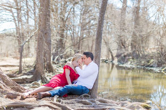 Heath's Engagement session Cibolo Natural Area snuggling by the river