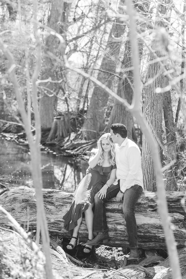 Heath's Engagement session Cibolo Natural Area sitting on the oak by the river