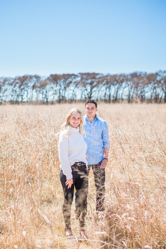 Heath's Engagement session Cibolo Natural Area her leading in the grass