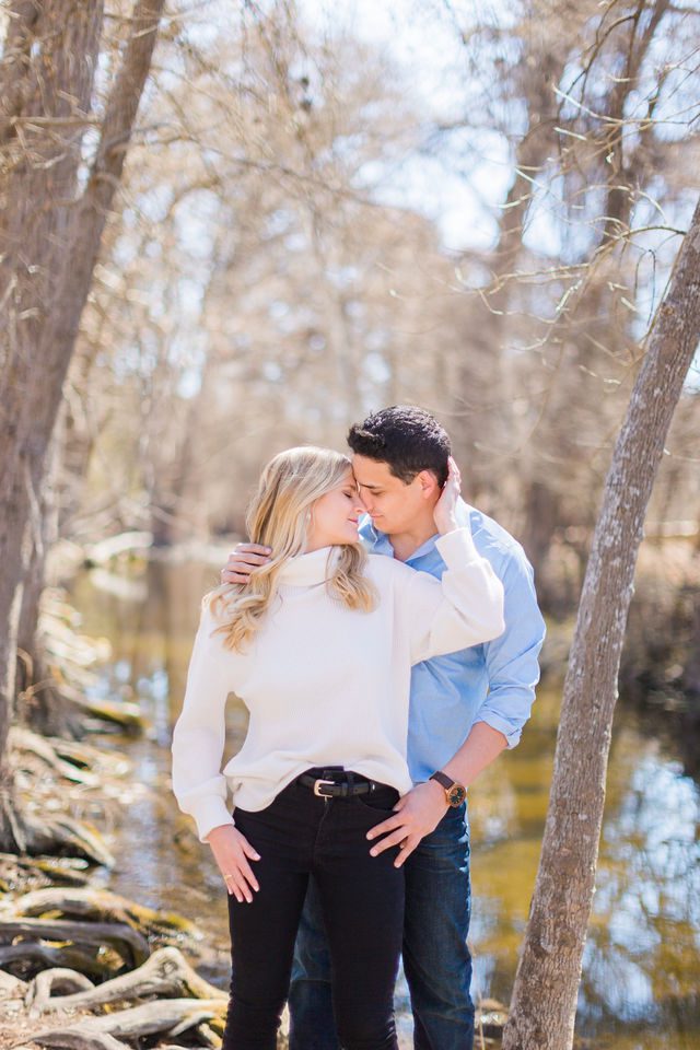 Heath's Engagement session Cibolo Natural Area head touch by the river