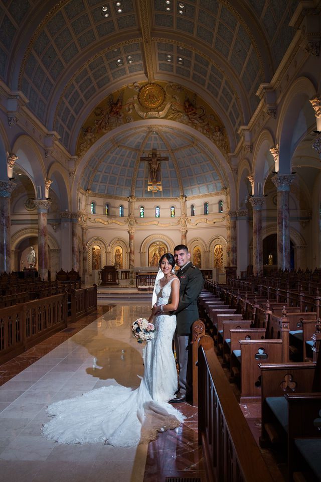 Kylee's wedding at OLLU Scared Heart Chapel couple portrait on the aisle